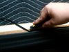 Trimming new rail cloth to fit